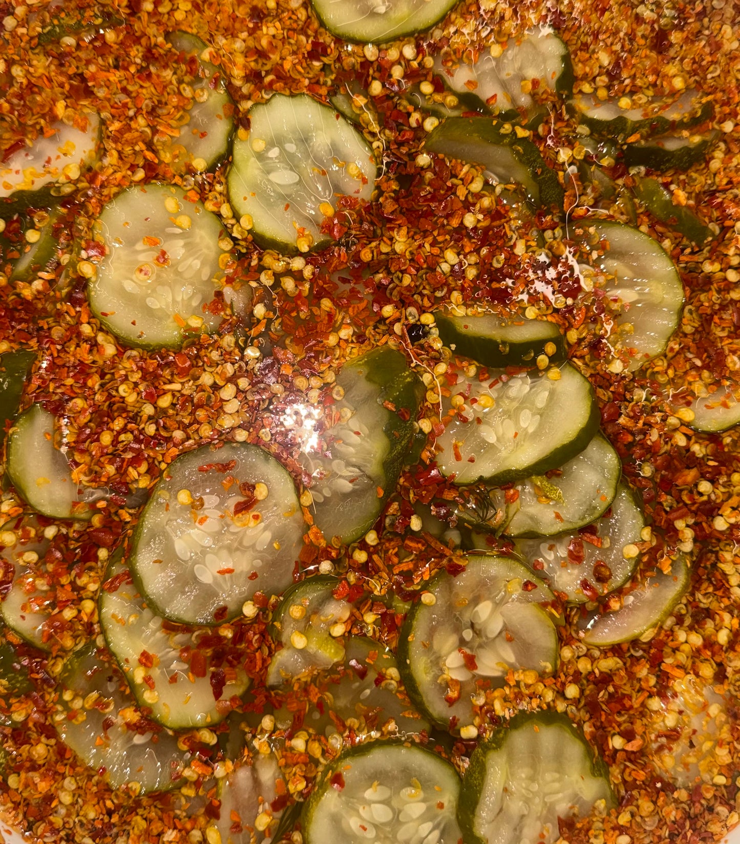Sliced spicy garlic dill pickles as crinkle cut pickle chips